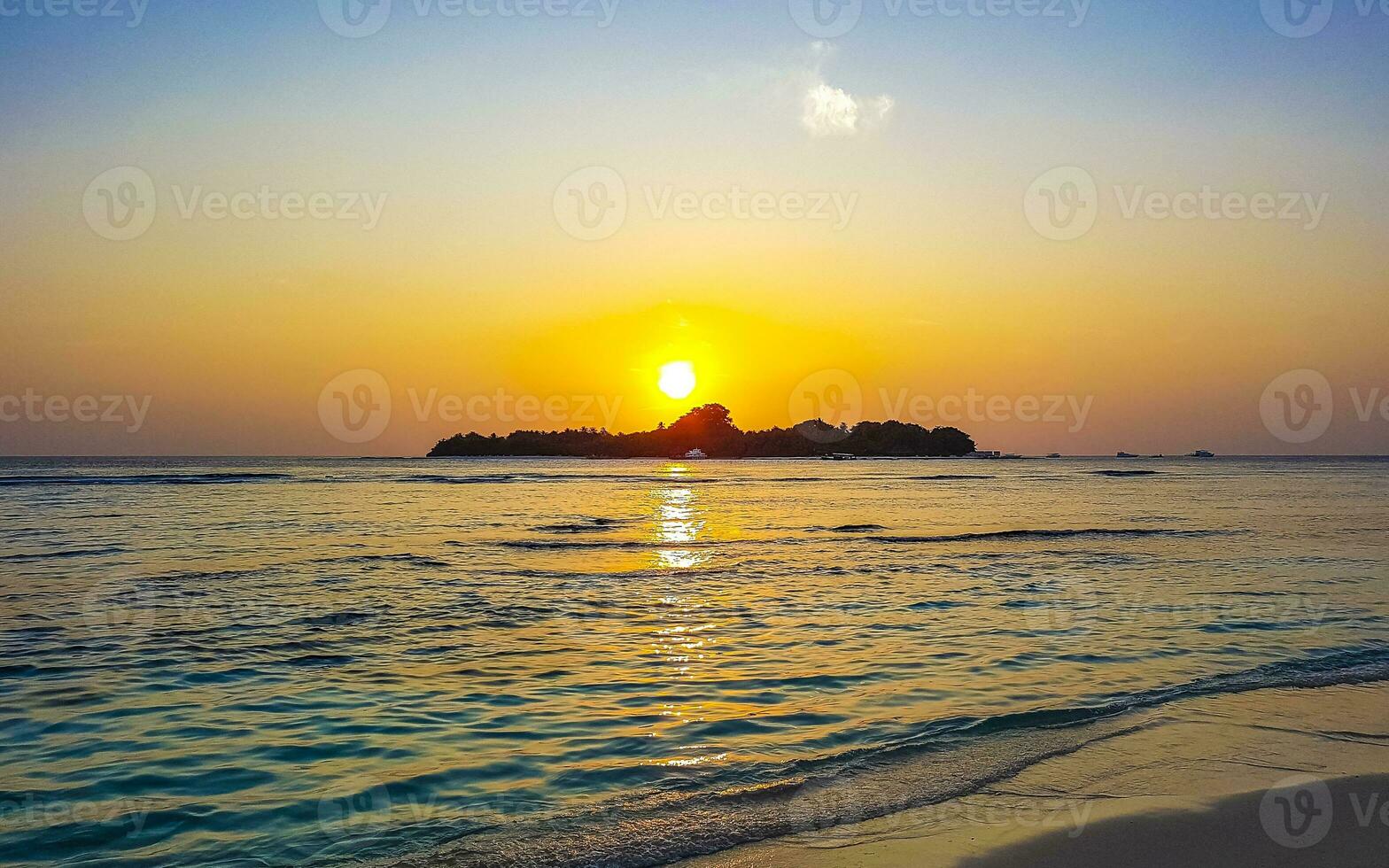 Kuramathi Maldives tropical paradise island sunset view from Rasdhoo. photo
