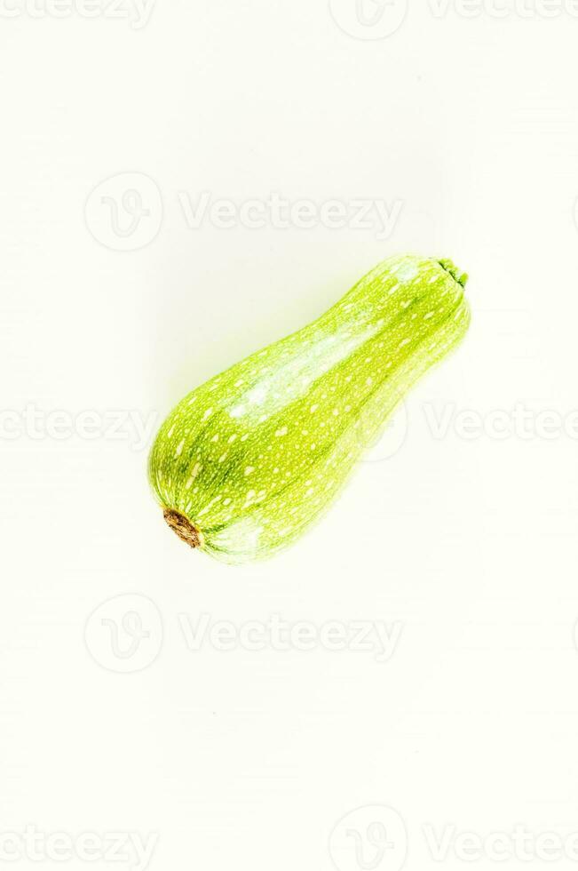 a single green squash on a white background photo