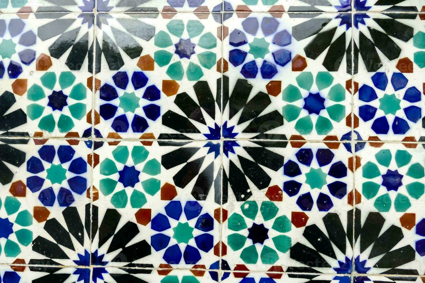 a close up of a colorful tile wall photo