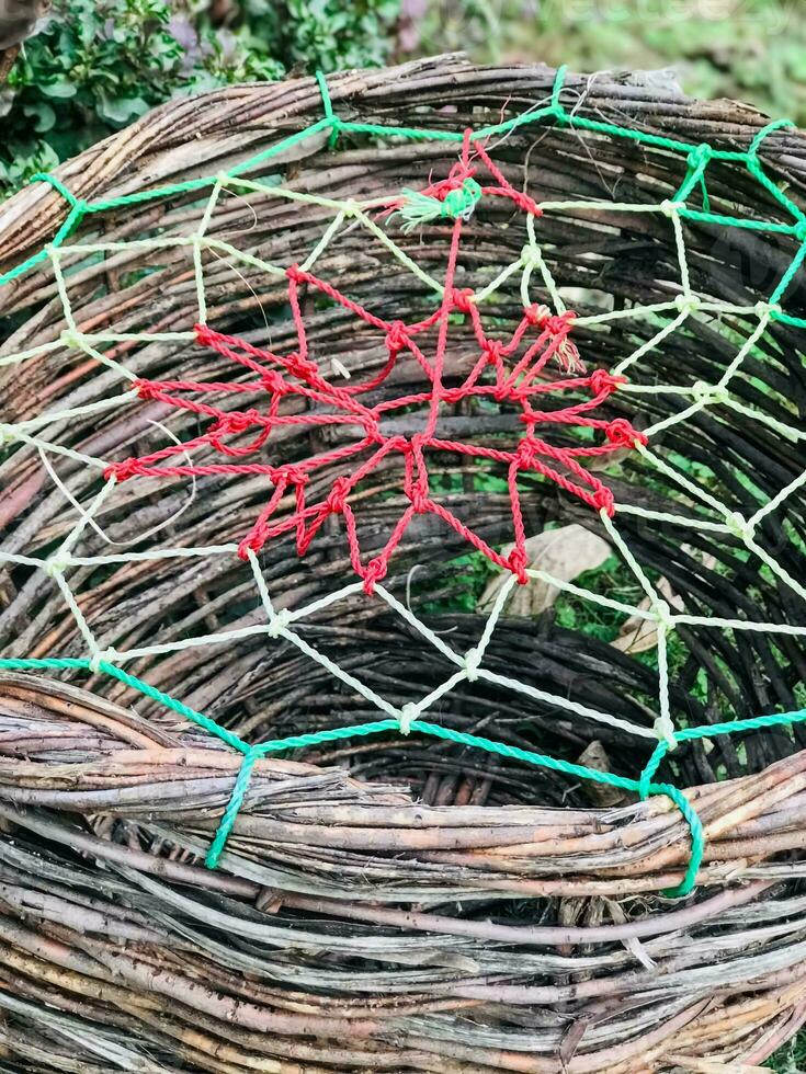 a basket with a red and green net on it photo