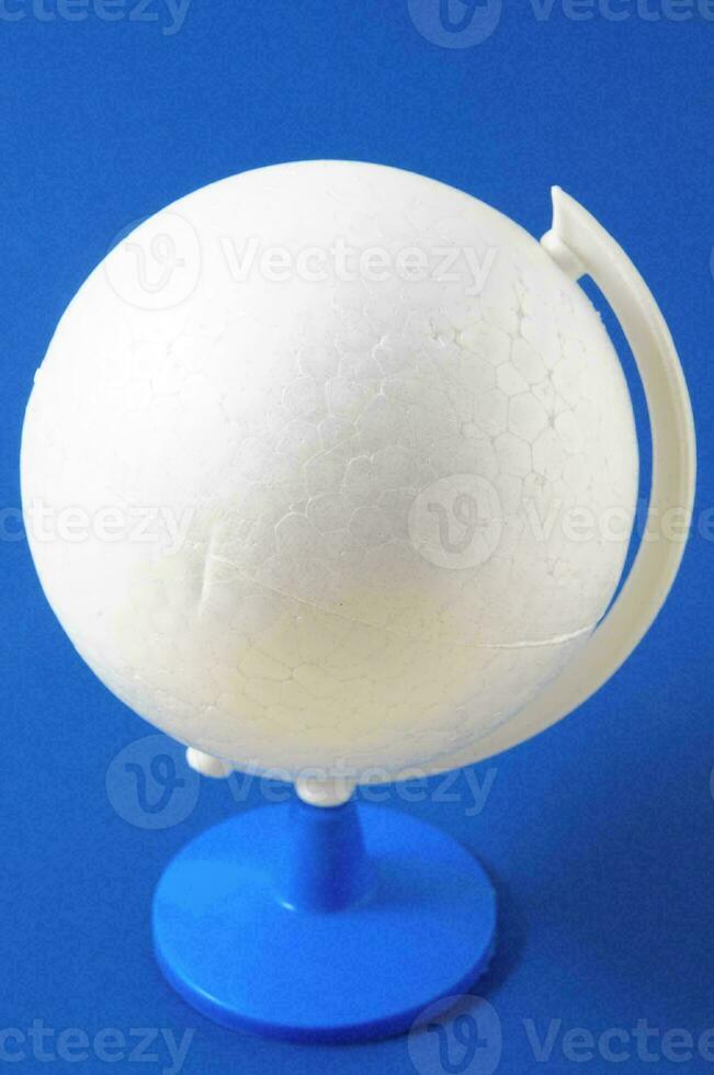 a white sphere on a blue stand photo