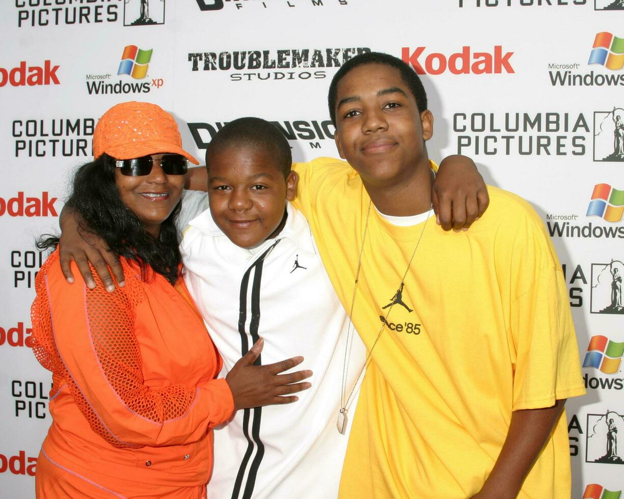 Kyle Massey and mother with brother Chris arrive at the Shark Boy and Lava Girl Premiere El Capitan Theater Los Angeles CA June 4 2005 photo