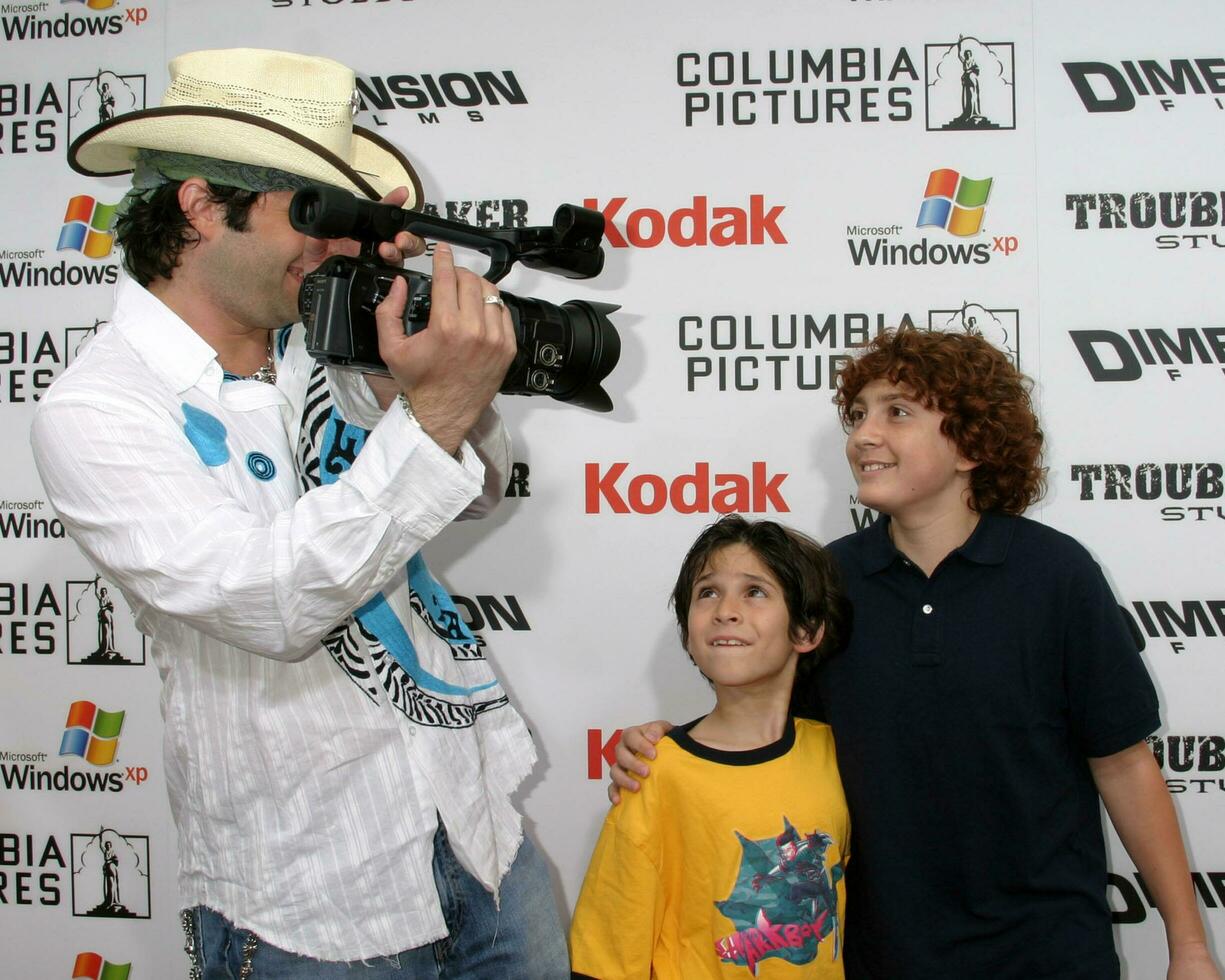 Robert Rodriguez and son Racer Max with Darryl Sabara arrive at the Shark Boy and Lava Girl Premiere El Capitan Theater Los Angeles CA June 4 2005 photo