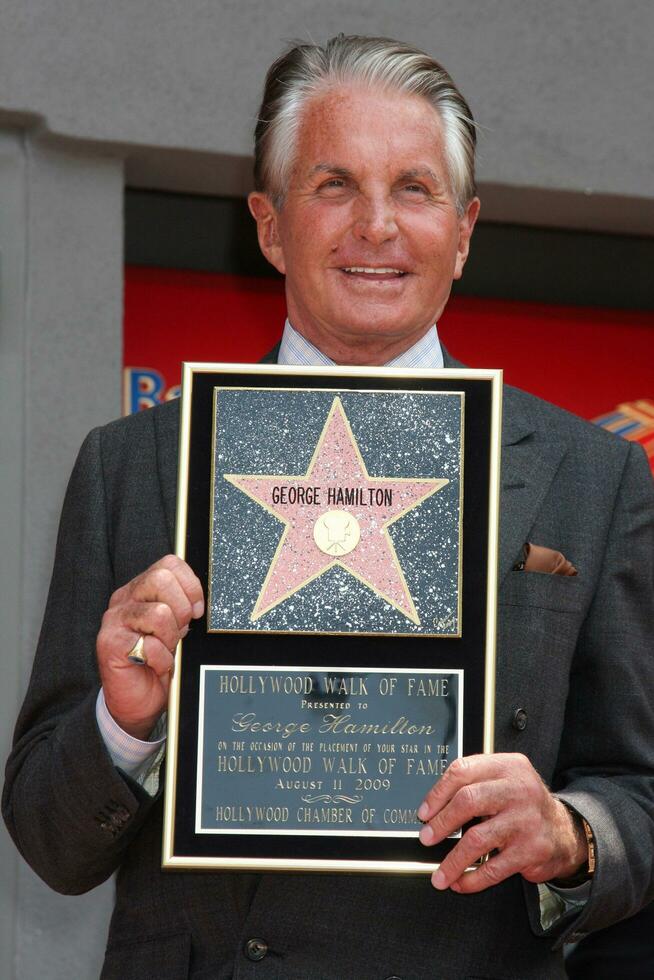 George Hamilton at the Hollywood Walk of Fame ceremony bestowing a Star in his honor  in Hollywood CA  on August 12  2009 photo