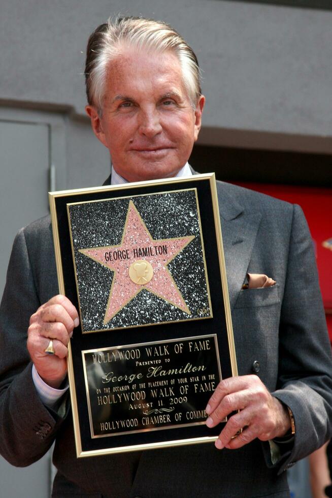 George Hamilton at the Hollywood Walk of Fame ceremony bestowing a Star in his honor  in Hollywood CA  on August 12  2009 photo