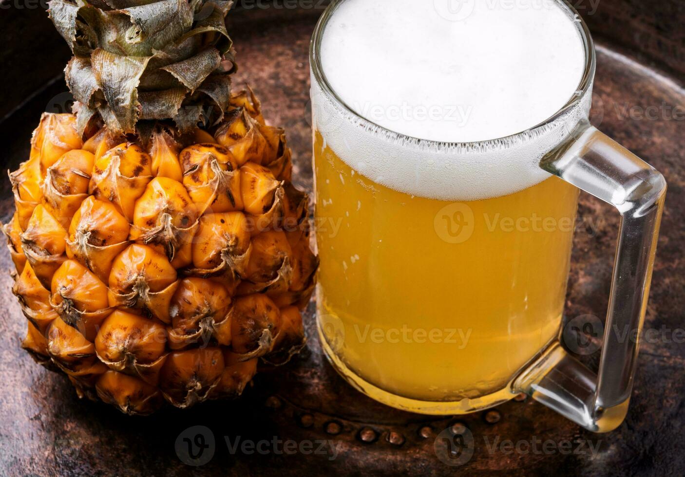 Glass with pineapple ale photo