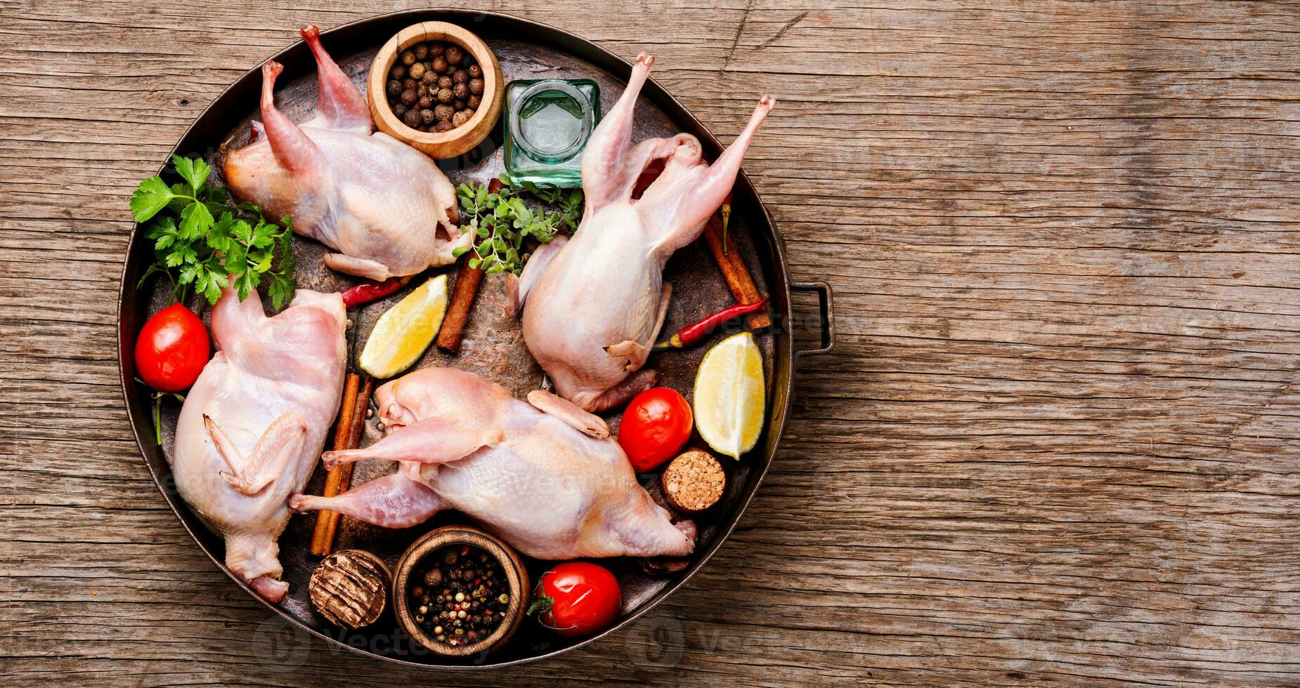 Whole raw quail photo