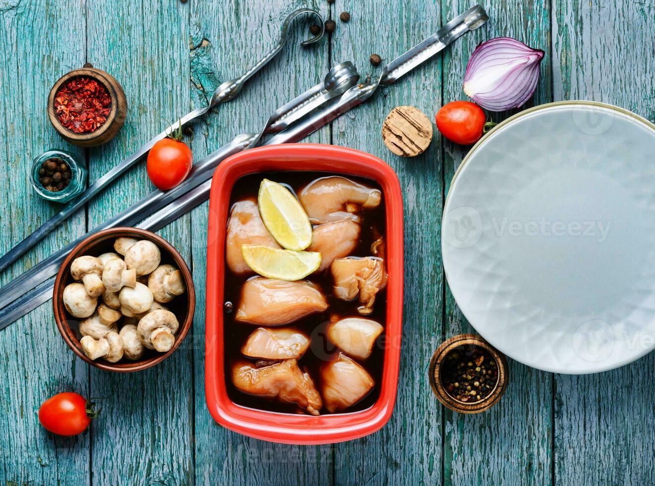 Raw marinated chicken meat photo