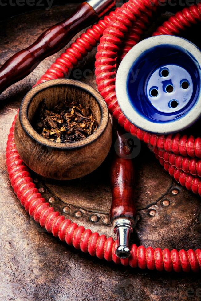 Smoking hookah with tobacco photo