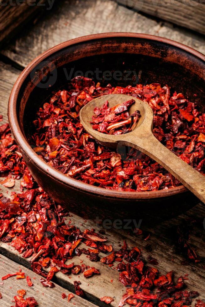 Heap of red pepper flakes photo