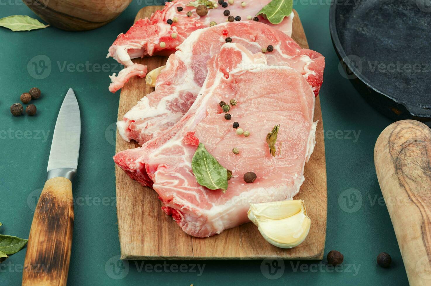 Raw pork steak on the bone photo