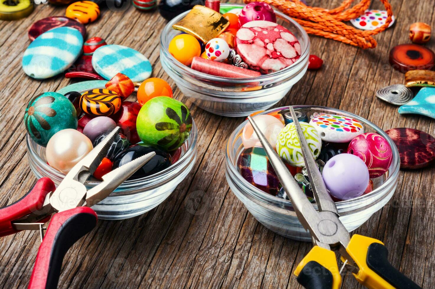 Colorful beads on a wooden surface photo