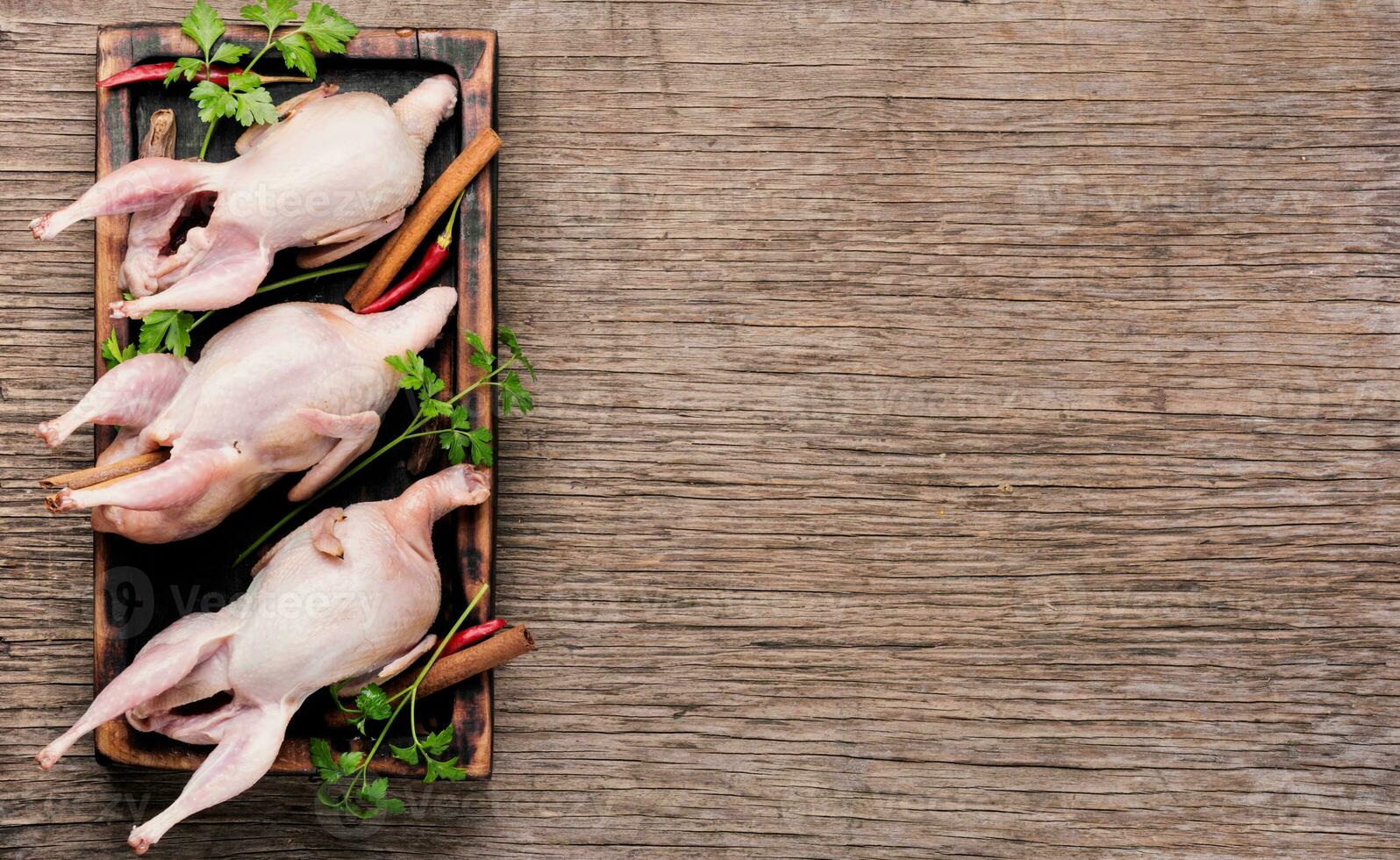 Whole raw quail photo