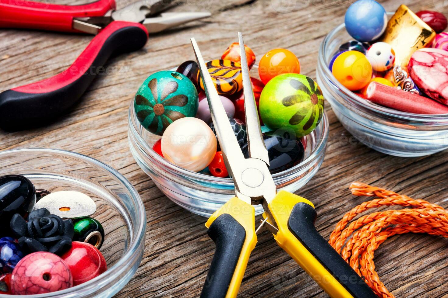 Colorful beads on a wooden surface photo