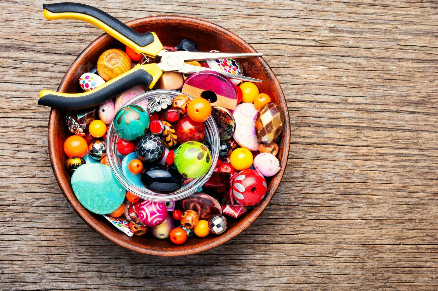 Colorful beads on a wooden surface photo