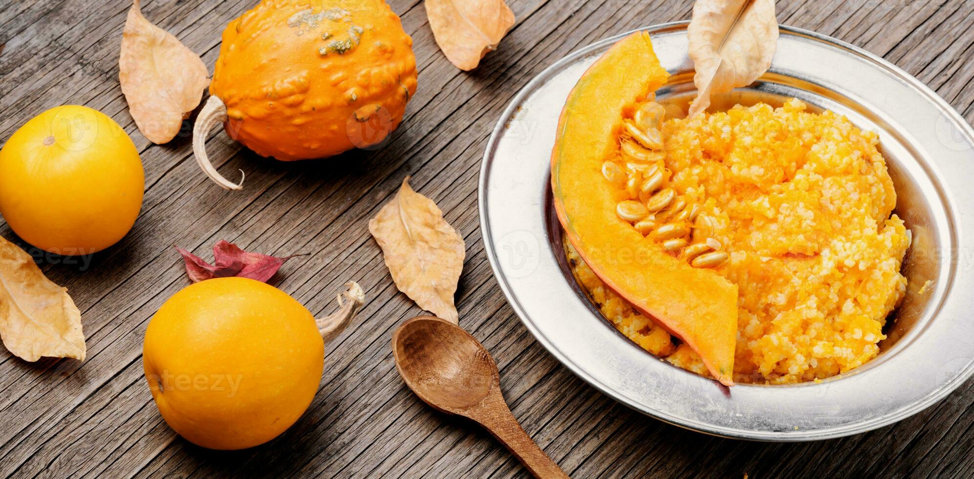 Autumn porridge with pumpkin photo
