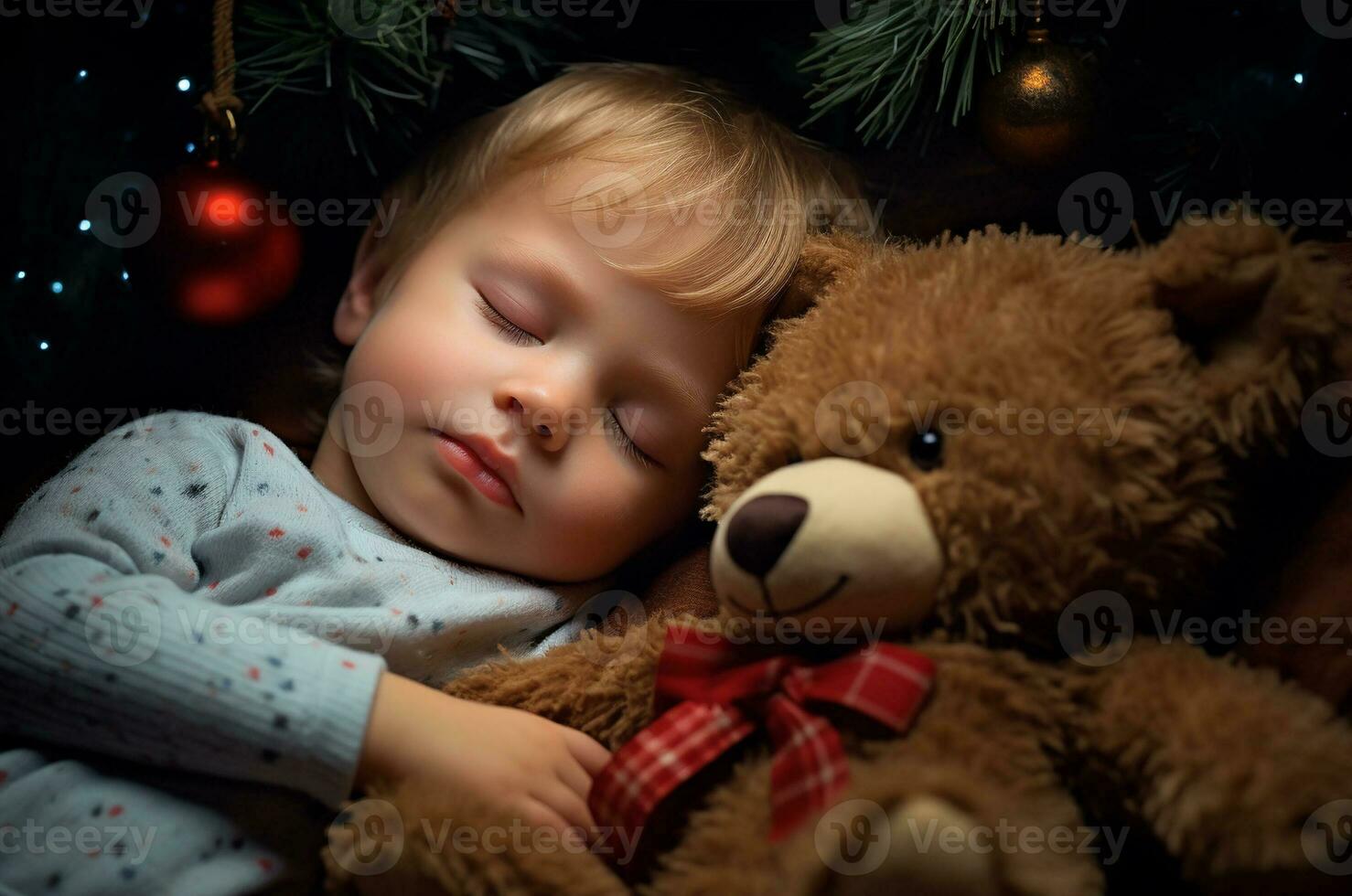 Toddler boy in pajamas sleeps with a teddy bear near the Christmas tree. Generative AI photo