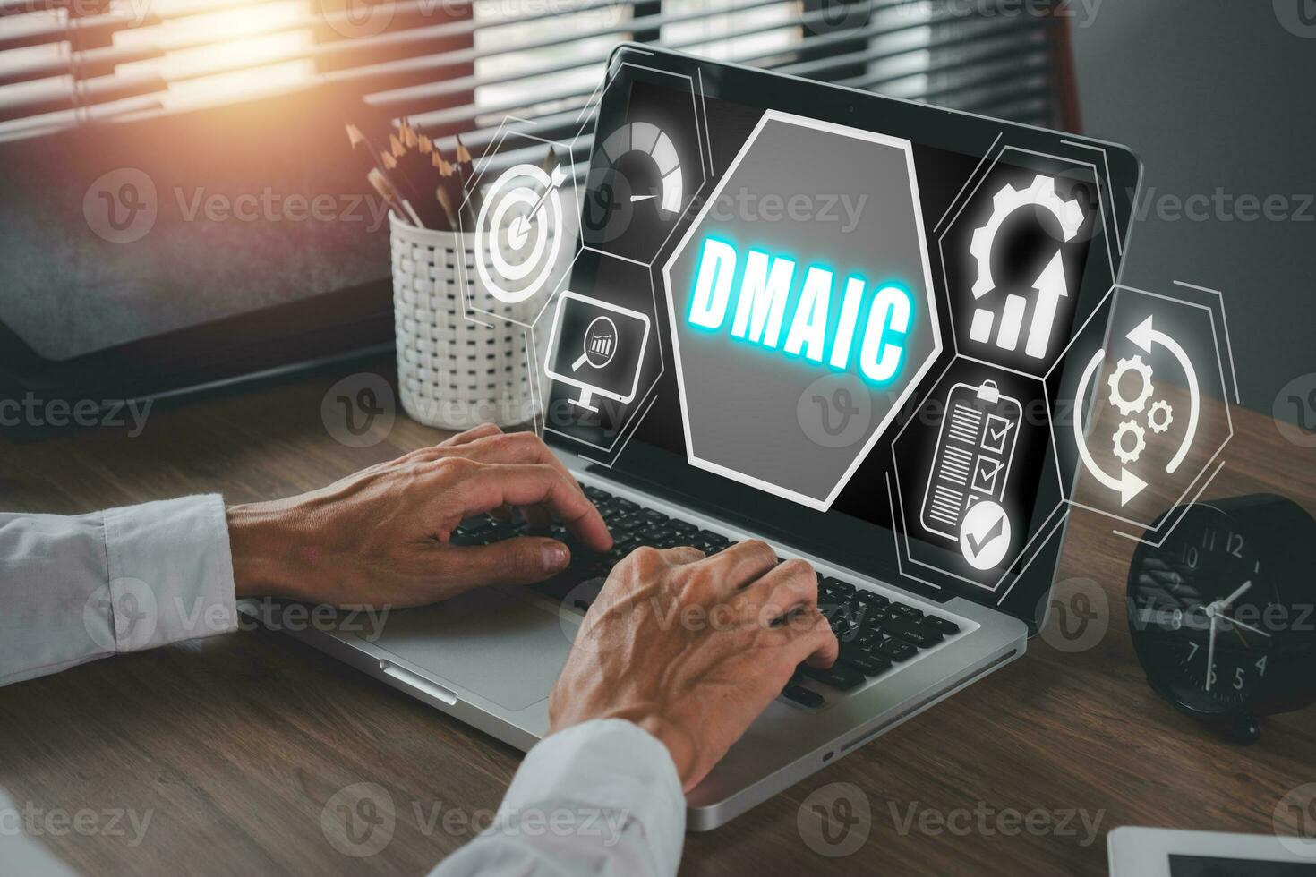 DMAIC, Define, Measure, Analyze, Improve and Control concept, Businessman using laptop computer on desk with DMAIC icon on virtual screen. photo