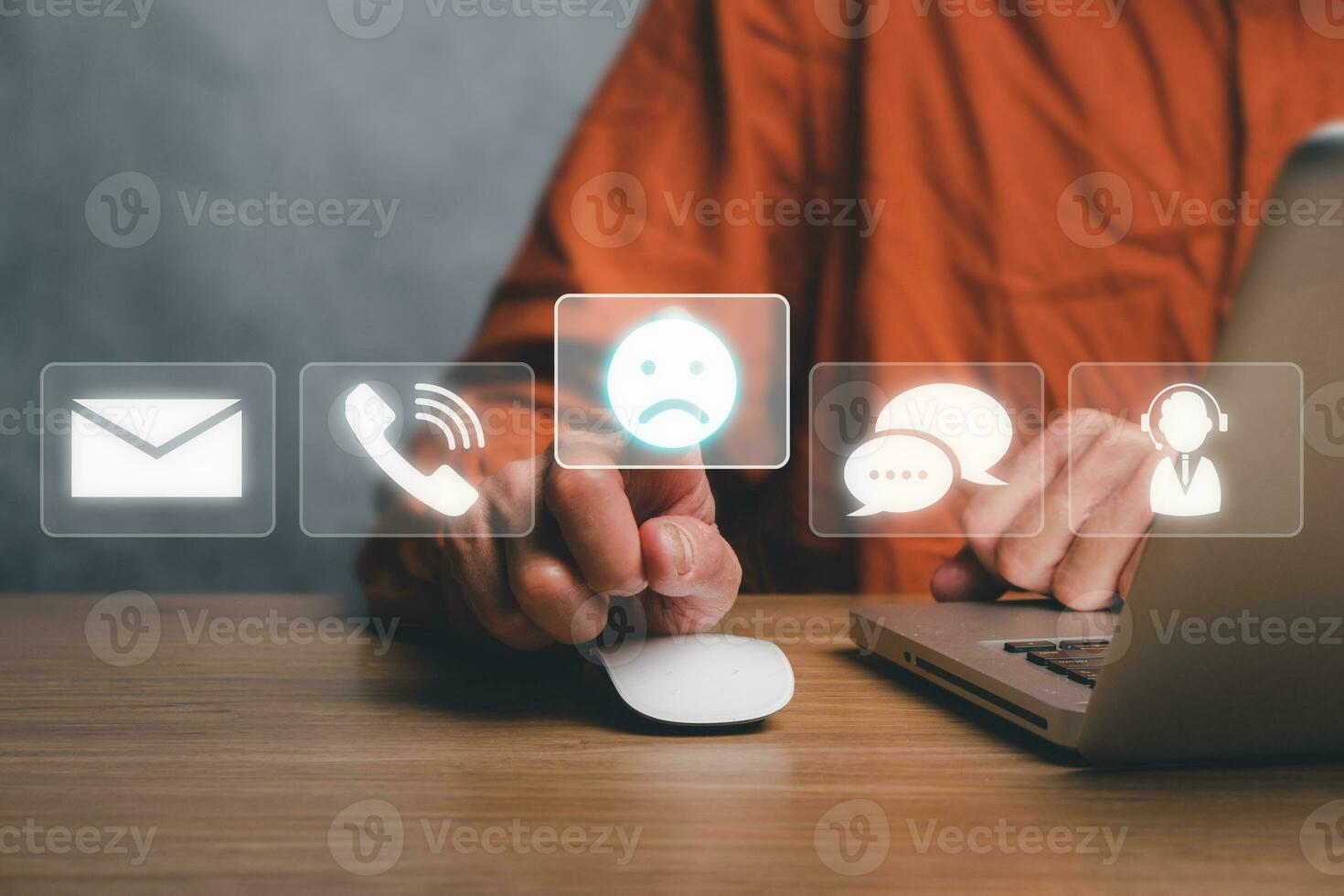 Complaints concept, Businessman using laptop omputer with complaints icon on vr screen, dissatisfaction from product or service problem, angry feedback from client. photo