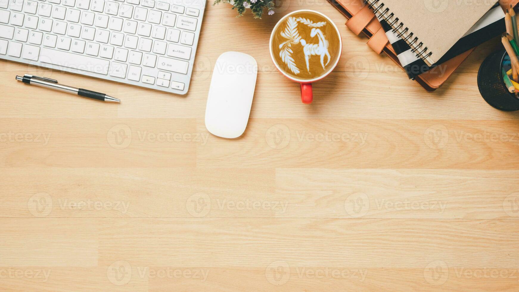 Flat lay, Wooden office desk with notebook, keyboard computer, eyeglass, mouse, pen and coffee, Top view with copy space, Mock up. photo