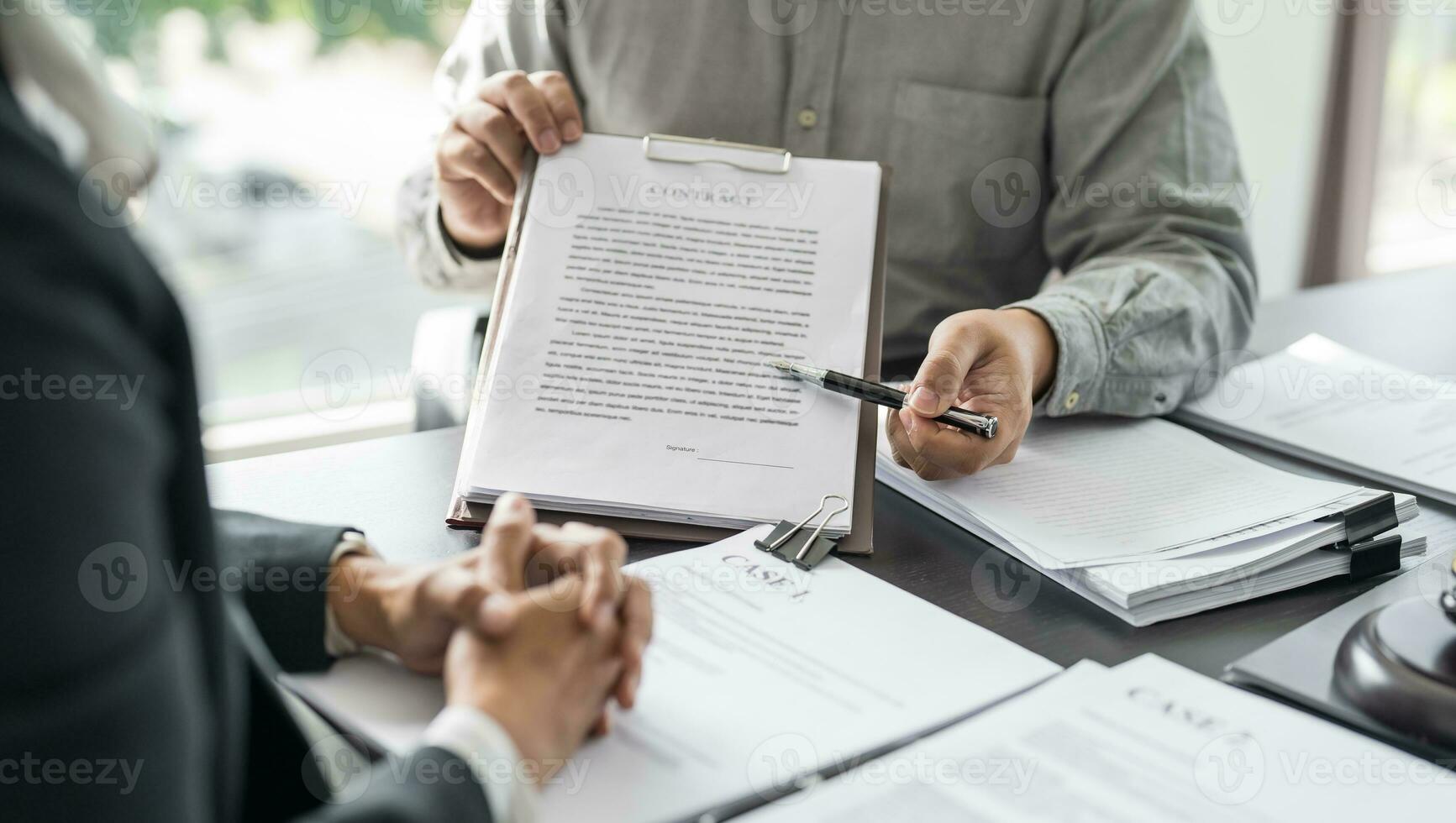 Lawyer Legal counsel presents to the client a signed contract with gavel and legal law. justice and lawyer Business partnership meeting concept photo
