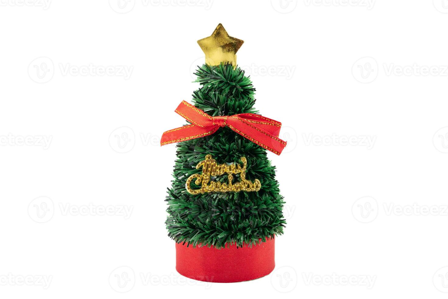 Little Christmas tree with red ribbon and text merry Christmas isolated on white background. Clipping path. photo