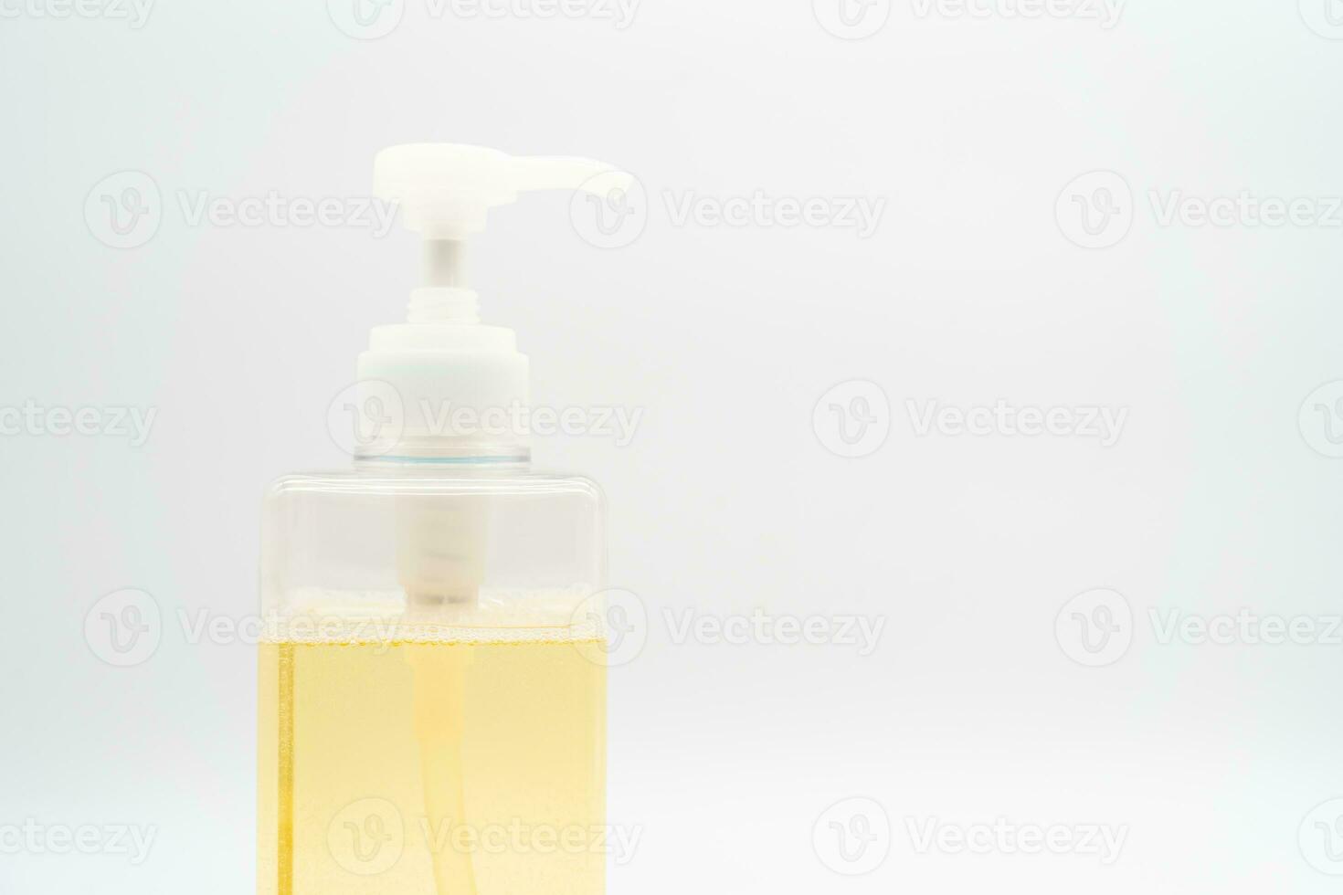 Yellow liquid soap or shampoo by pouring it from a refill to reduce plastic waste. Sustainable Zero Waste. photo