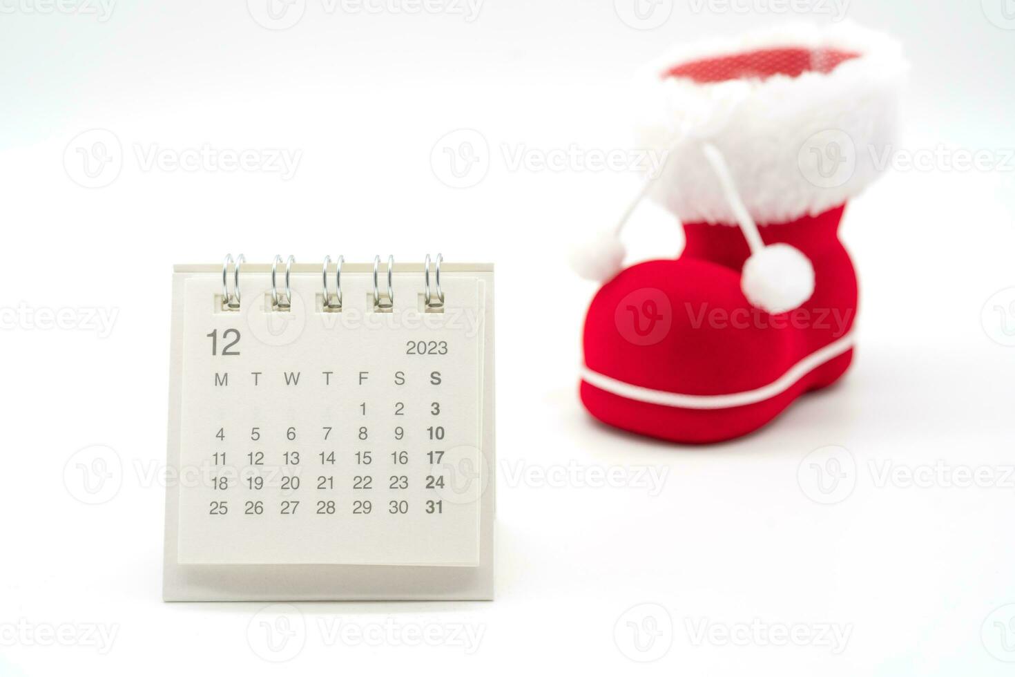 December's calendar image with Santa's shoe isolated on white background. Christmas background. photo