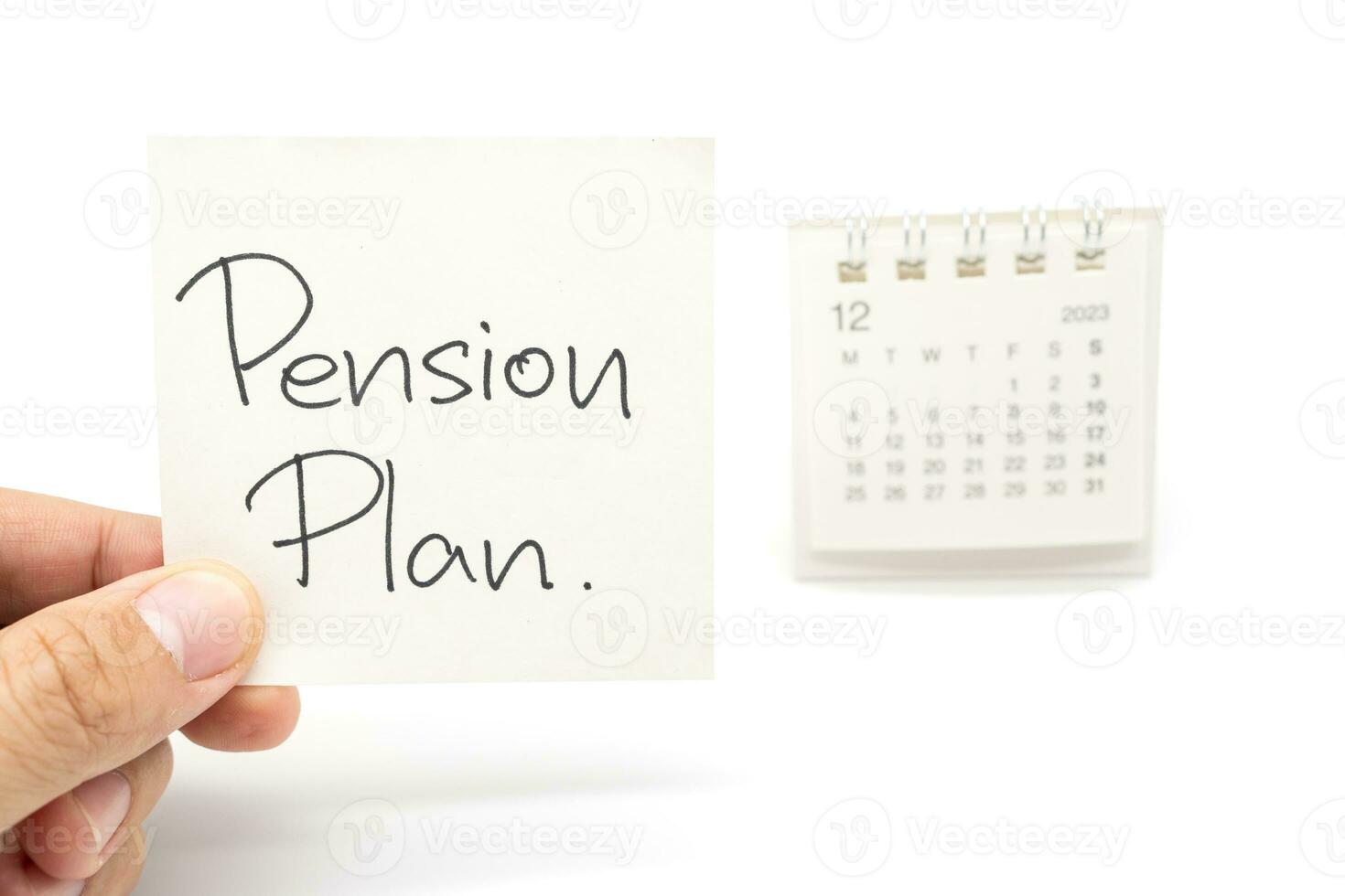 Desk calendar and Pension Plan Note Paper isolated on white background. For retirement, Pension Plan concept. Last date of work. photo