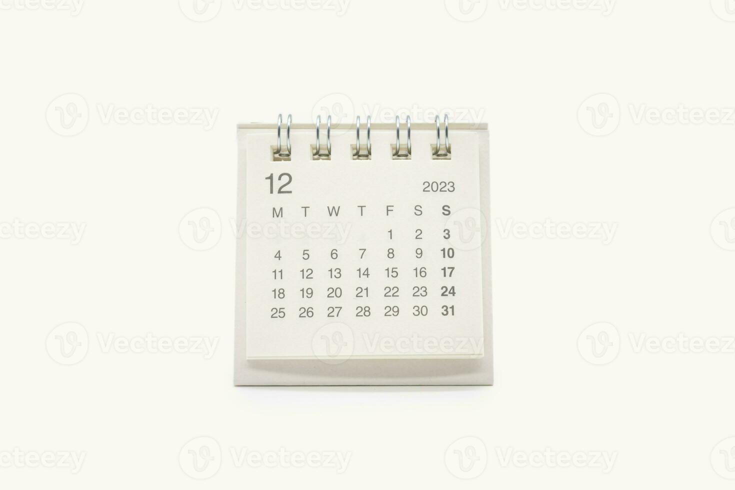 Simple desk calendar for December 2023 isolated on white background. Calendar concept with copy space. photo