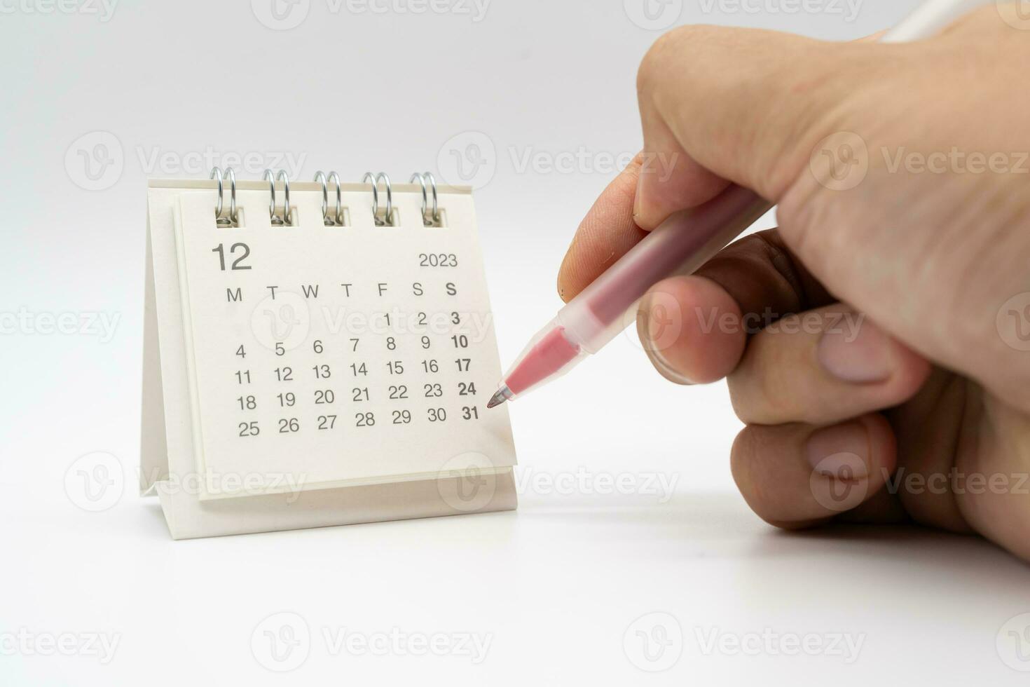 Month planning in the calendar. Calendar Deadline. Red Pen for Marking Date. Appointment calendar and pen. photo