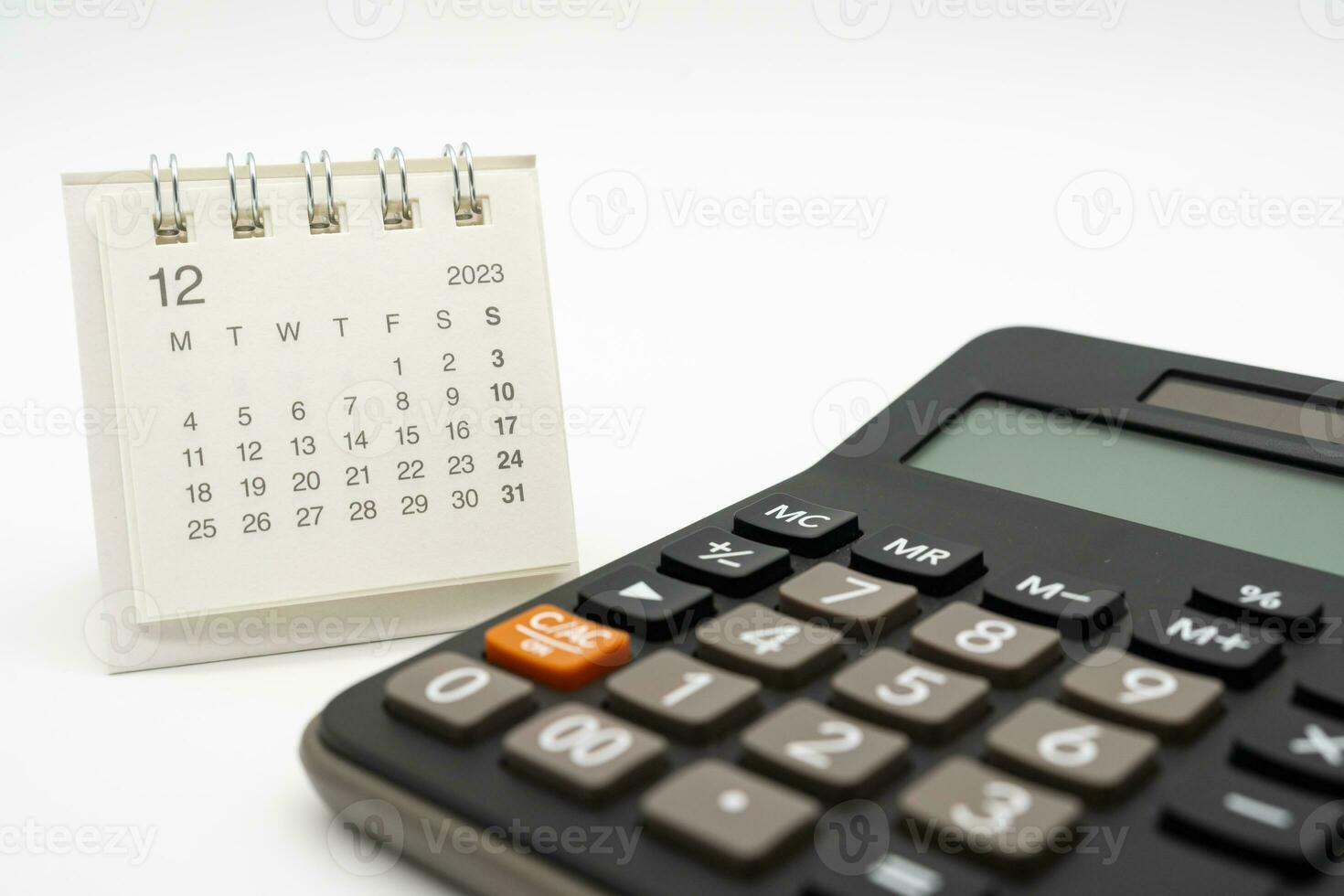 calculator and calendar on white background for money and debt management concept. Economic calculation before 2024. photo