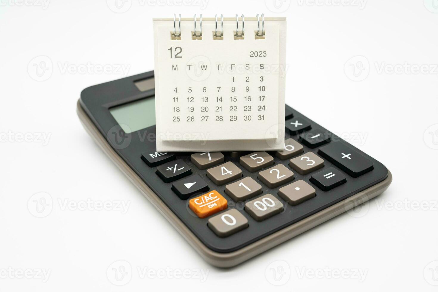 calculator and calendar DEC 2023 on white background for money and debt management concept. Economic calculation before 2024. photo