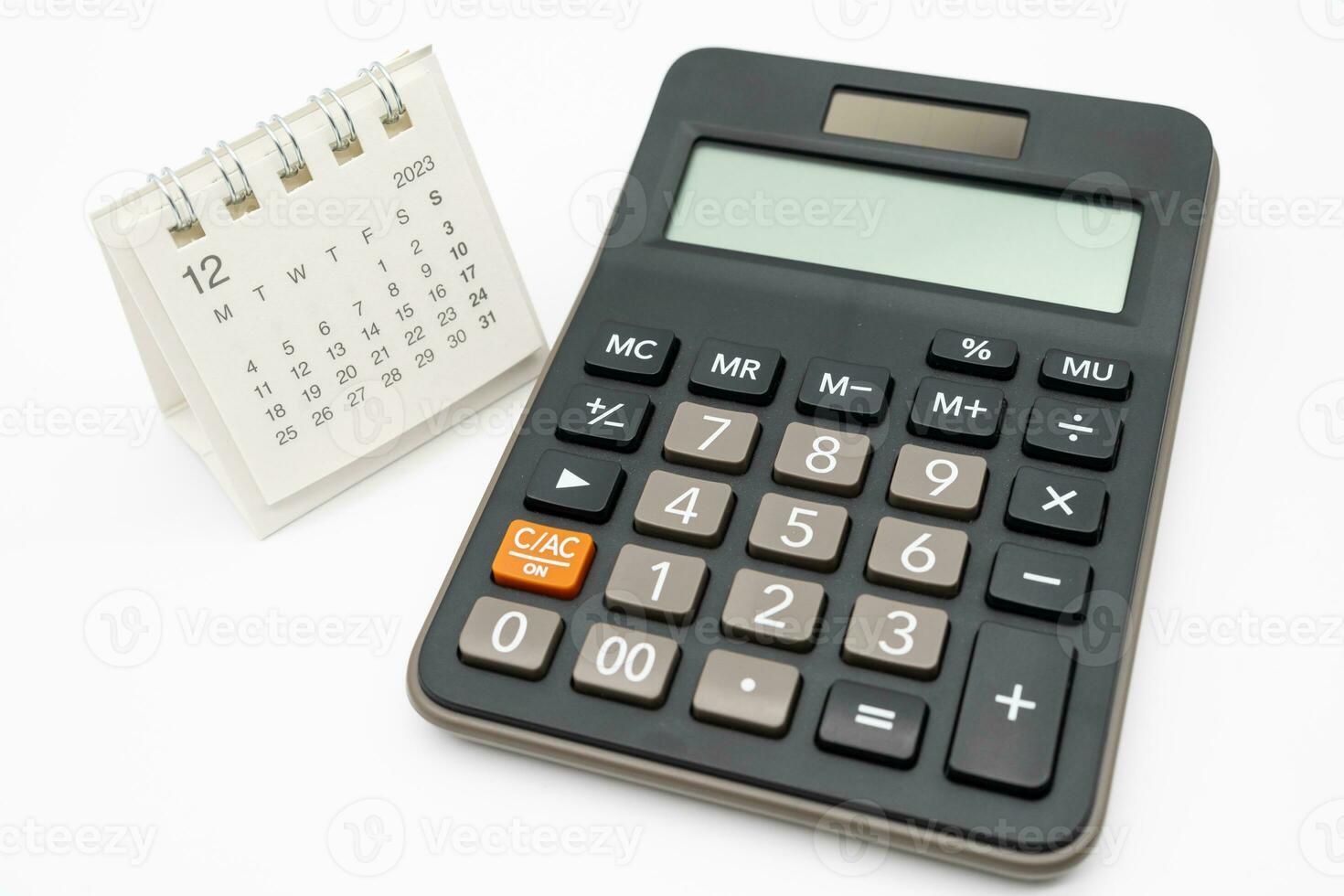 calculator and calendar DEC 2023 on white background for money and debt management concept. Economic calculation before 2024. photo