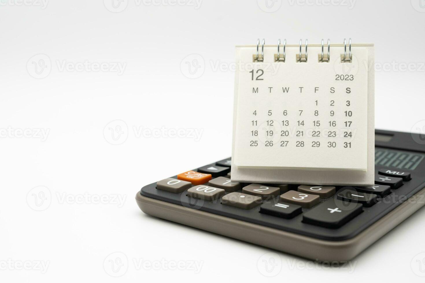 calculator and calendar DEC 2023 on white background for money and debt management concept. Economic calculation before 2024. photo