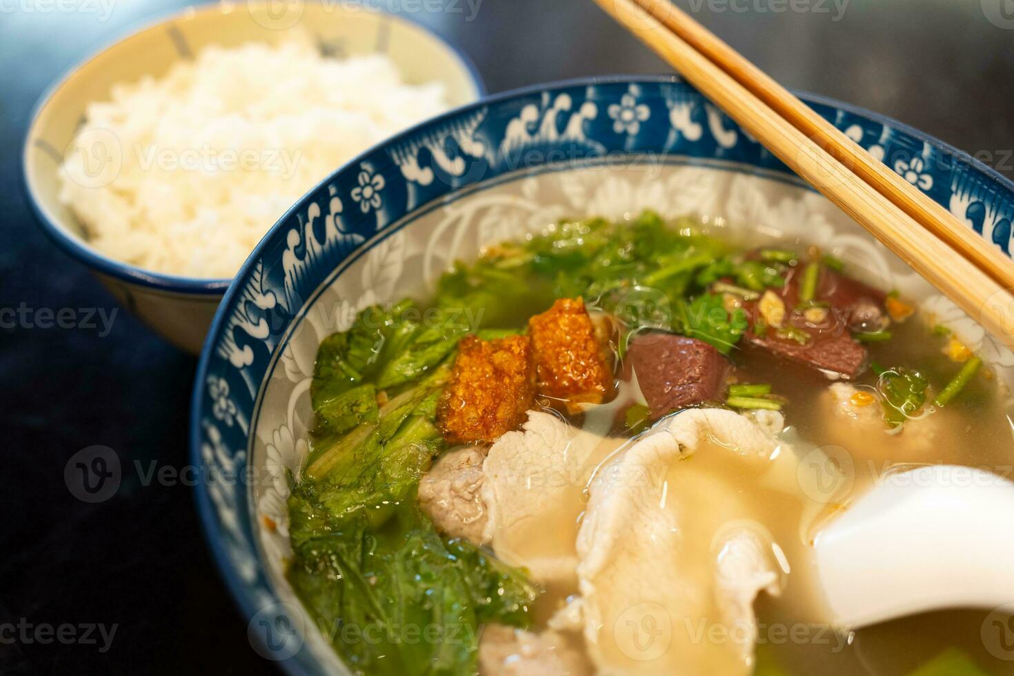 Blood pork pudding soup is Thai Style Blood Jelly with Offal Soup. Famous street food in Thailand. photo