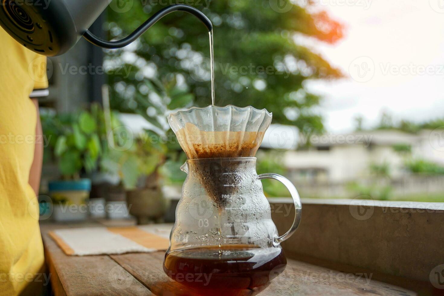 Drip coffee is a method of brewing pour-over or filter brewers in which the method of brewing coffee without a brewer is simply using water through coffee grounds and paper filter photo