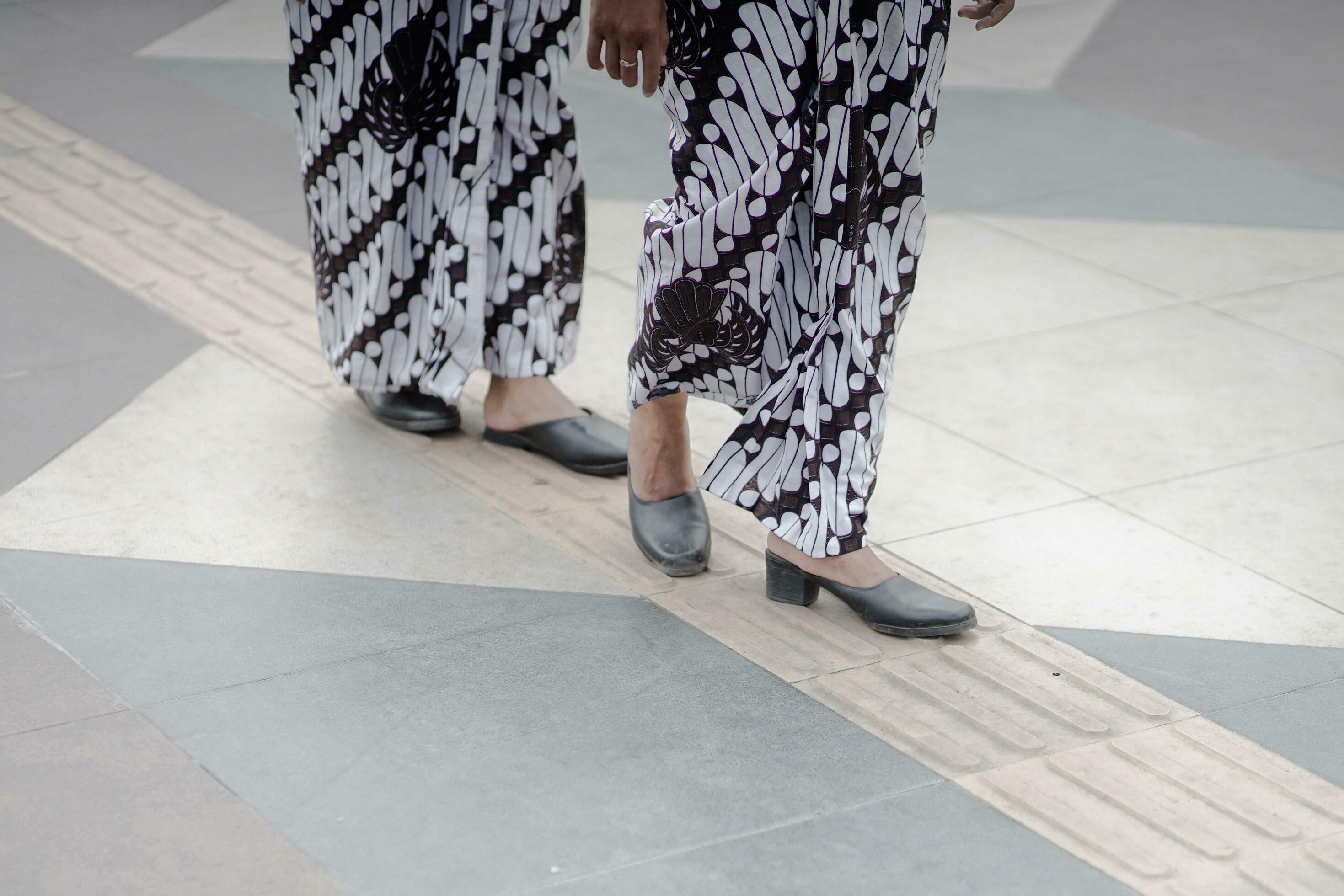 two women wearing black and white print pants 34455067 Stock Photo at ...