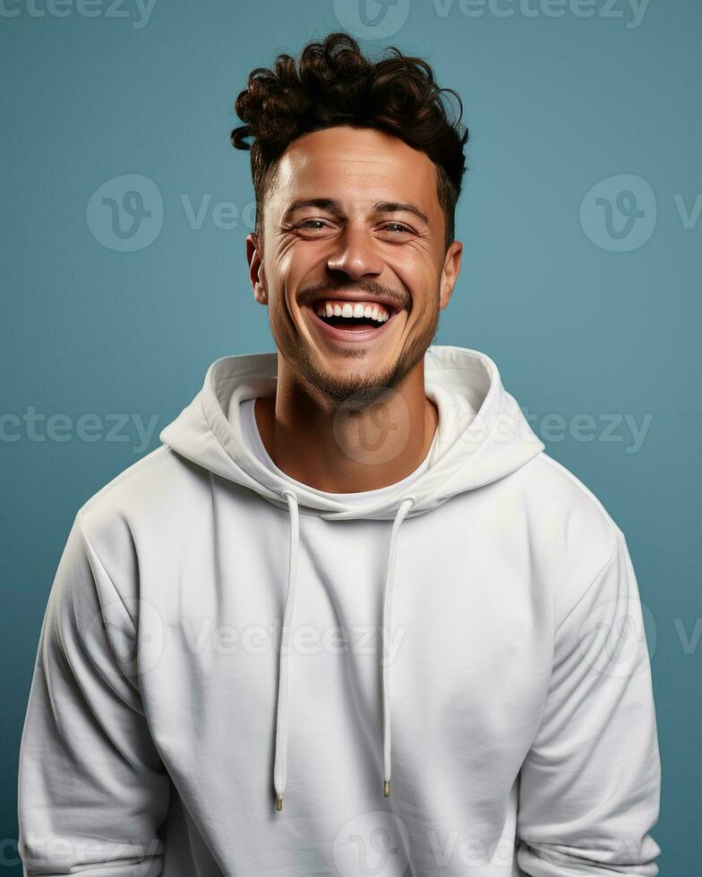 Young handome man smiling wearing sweatshirt isolated photo
