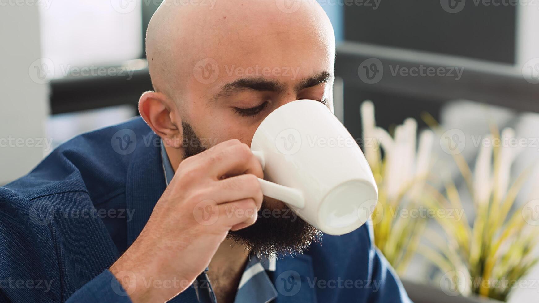 Business manager working on project in open space office, examining analytics and managing marketing campaign on laptop. Executive assistant brainstorming growth strategy ideas. photo
