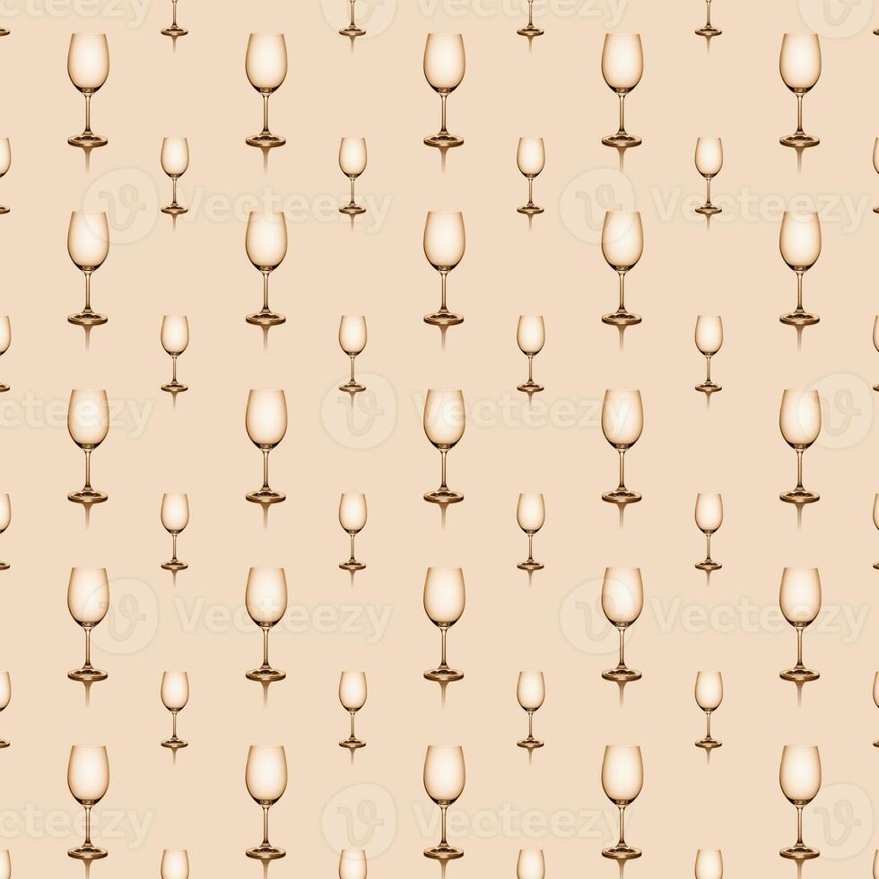 Seamless pattern of empty wine glasses on beige background. photo