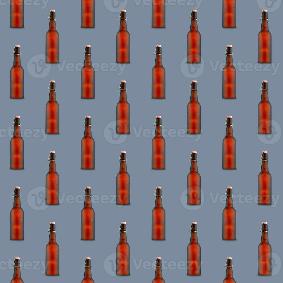 Seamless pattern of misted beer bottles on gray background. photo