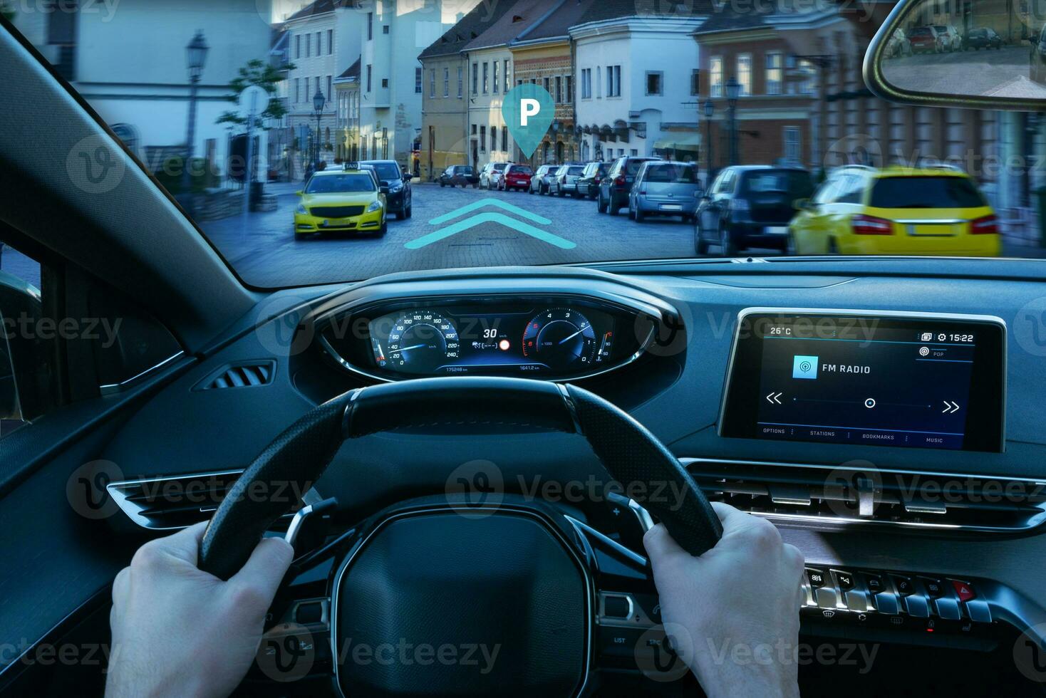 Inteligent car navigation to parking place concept. View from the driver's perspective photo