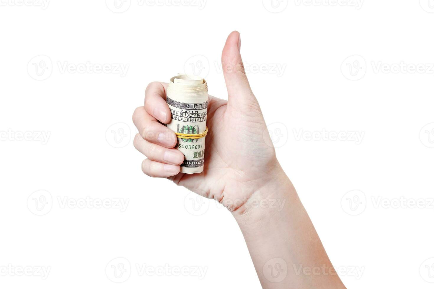 Thumbs up with roll of money isolated on white background 100 dollars photo