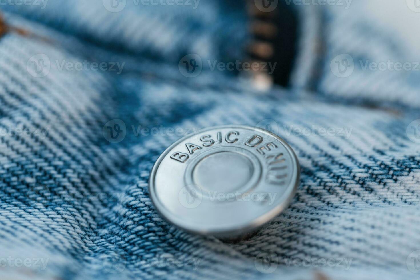 Stylish vintage blue jeans with metallic button basic denim, macro shoots photo
