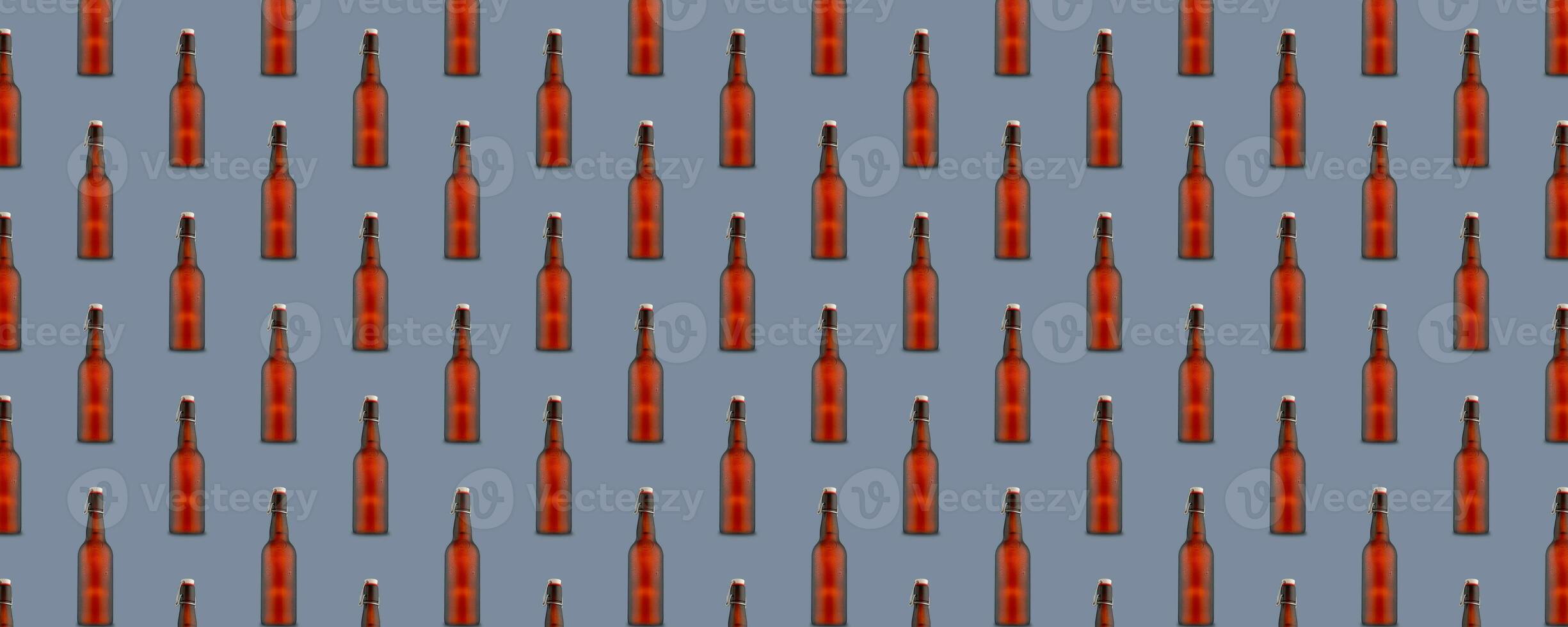 Seamless pattern of misted beer bottles on gray background. photo