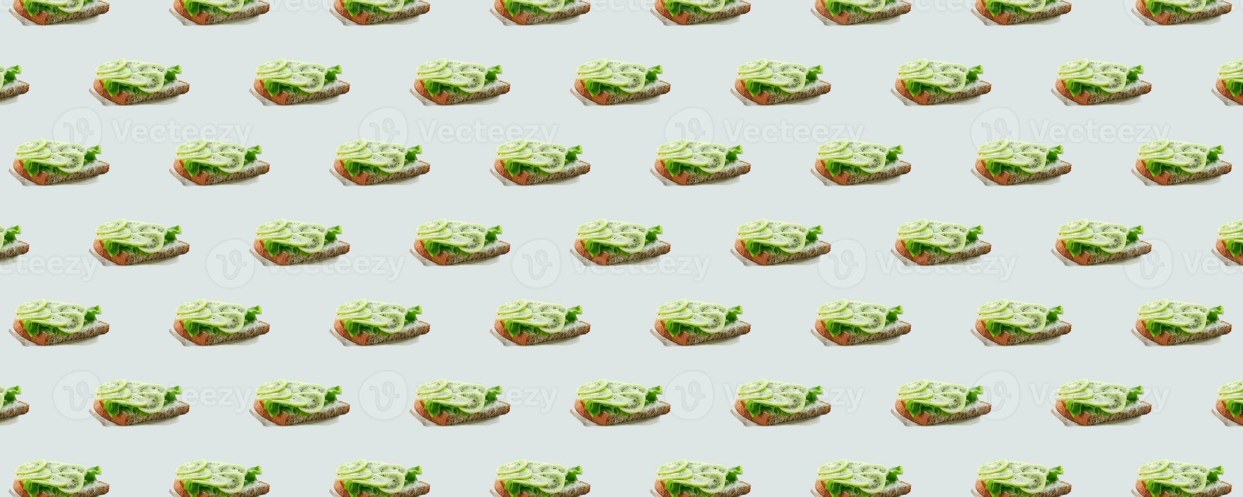 Seamless pattern of sandwiches with kiwi and soft cheese on a white background. Modern minimal food photography collage. Morning breakfast brunch concept. photo