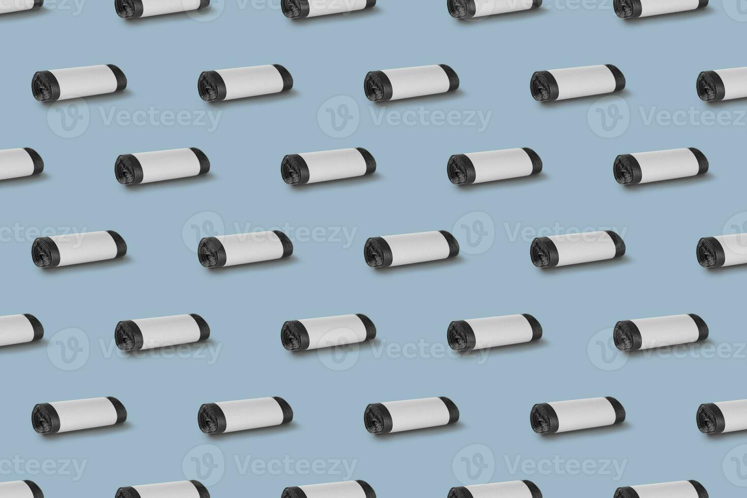 Horizontal seamless pattern. Rolls of garbage bags isolated on blue background. On the roll white copy space. photo