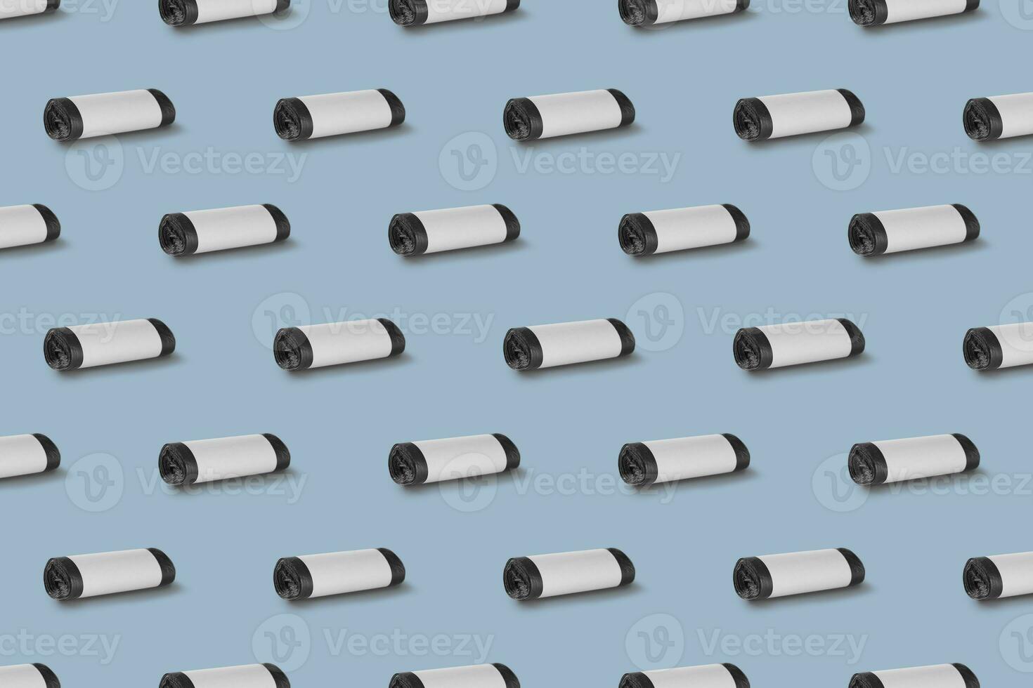 Horizontal seamless pattern. Rolls of garbage bags isolated on blue background. On the roll white copy space. photo
