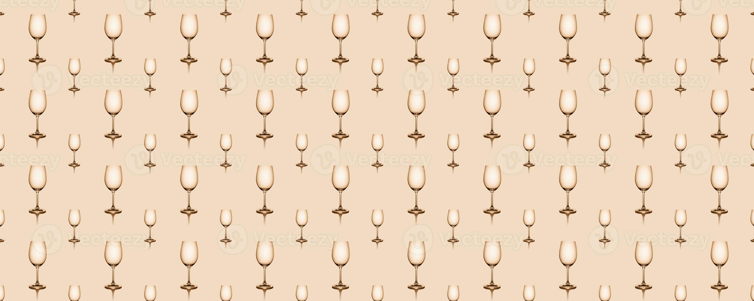 Seamless pattern of empty wine glasses on beige background. photo